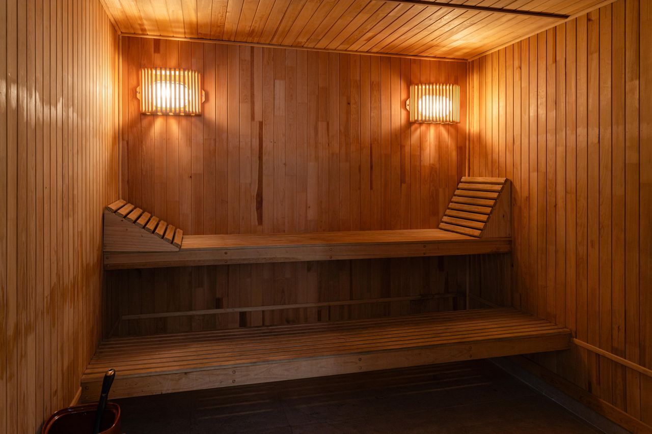 Crafting Captivating Headlines: Your awesome post title goes here A warm, inviting wooden sauna interior with soft lighting for a relaxing spa experience.