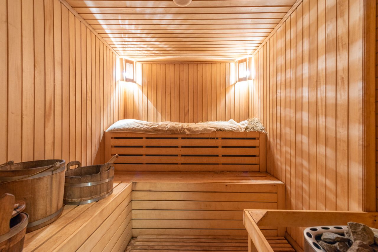 The Art of Drawing Readers In: Your attractive post title goes here Warm and inviting wooden sauna with ambient lighting, perfect for relaxation.